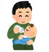 赤ちゃんにミルクをあげている父親